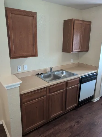 a room with a sink and a mirror