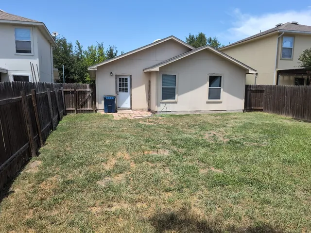 a view of a yard in front of house