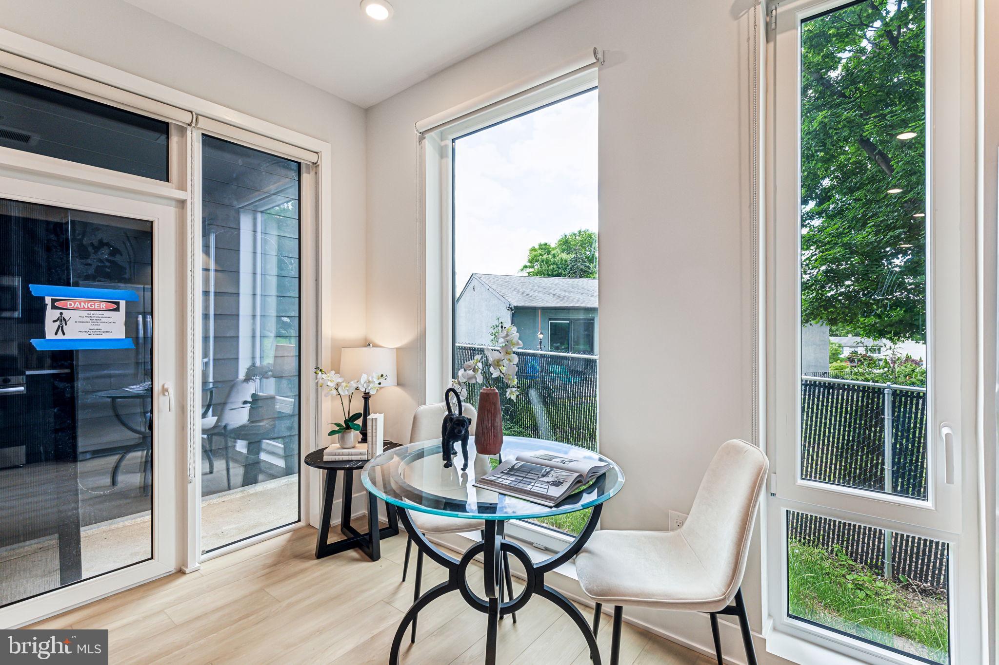6910 Ridge Avenue, Unit 214 Philadelphia, PA 19128 - Photo 7 of 20 a view of a dining room with furniture window and outside view