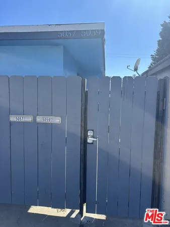 a bathroom with a shower and a sink