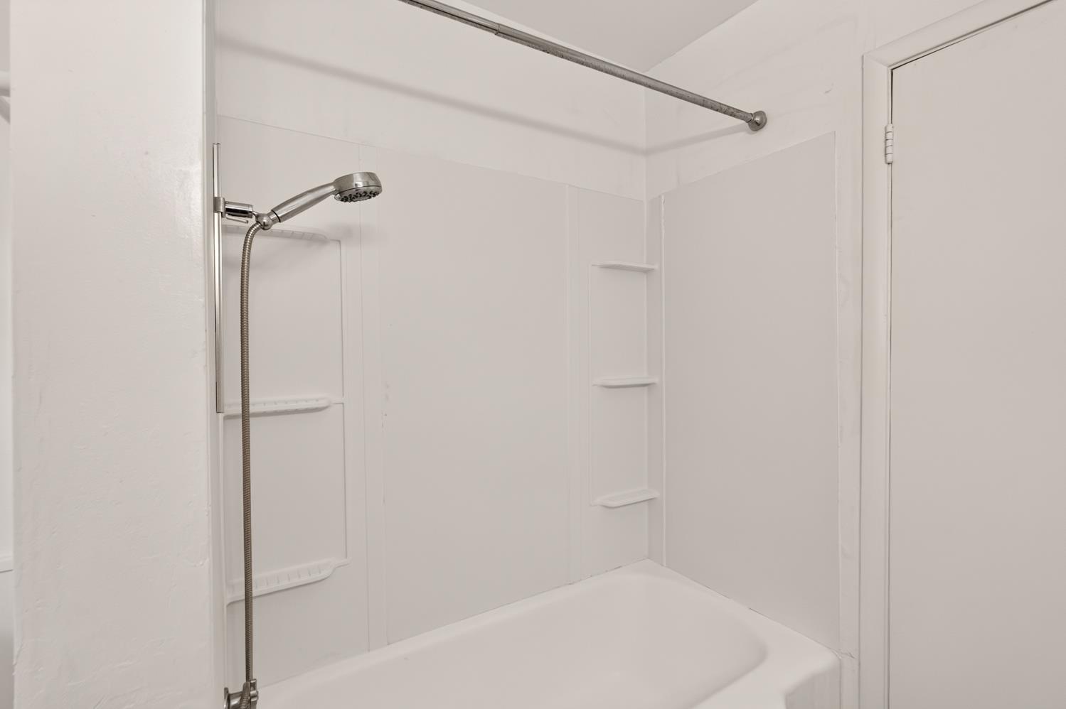 10700 Calvine Road Elk Grove, CA 95830 - Photo 36 of 73 a bathroom with a shower and a bath tub