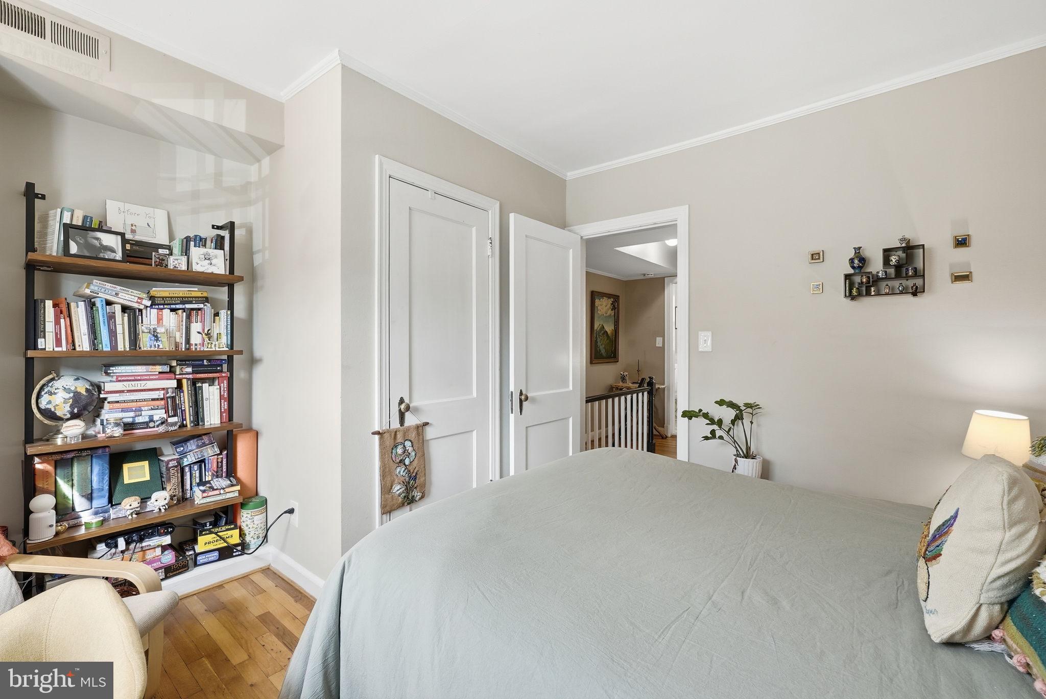 2700 13th Road South, Unit 510 Arlington, VA 22204 - Photo 14 of 17 a bedroom with a bed and a book shelf