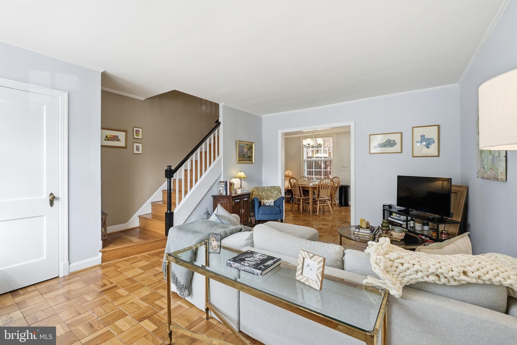 2700 13th Road South, Unit 510 Arlington, VA 22204 - Photo 2 of 17 a living room with furniture and a flat screen tv