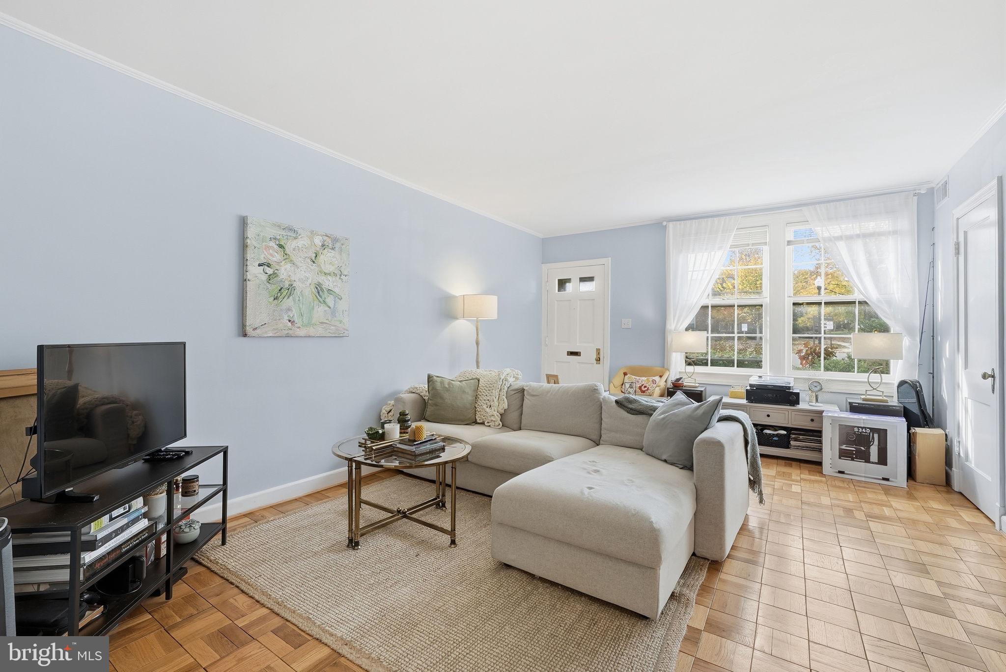 2700 13th Road South, Unit 510 Arlington, VA 22204 - Photo 3 of 17 a living room with furniture and a flat screen tv