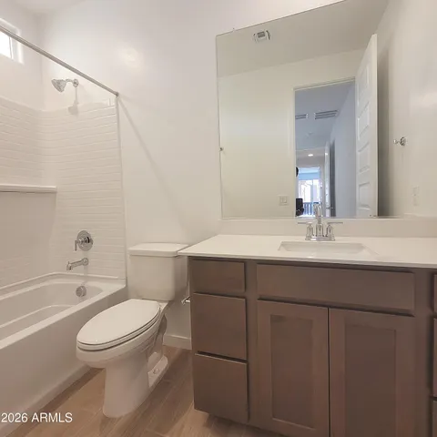 a bathroom with a sink a toilet and a bathtub
