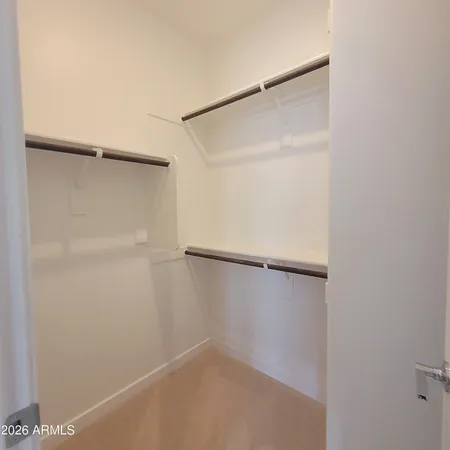 a view of an empty walk in closet