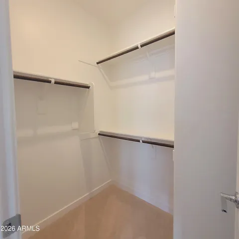 a view of an empty walk in closet