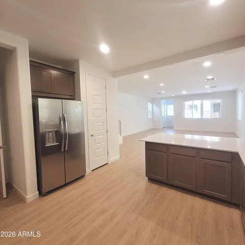 a large bathroom with a large mirror vanity and shower