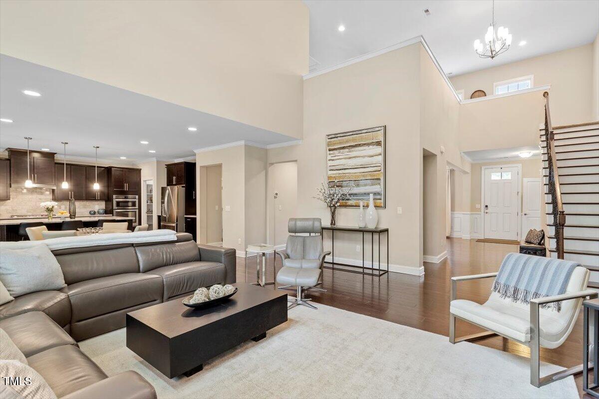 2421 Trenton Park Lane Raleigh, NC 27607 - Photo 21 of 66 a living room with furniture and kitchen view