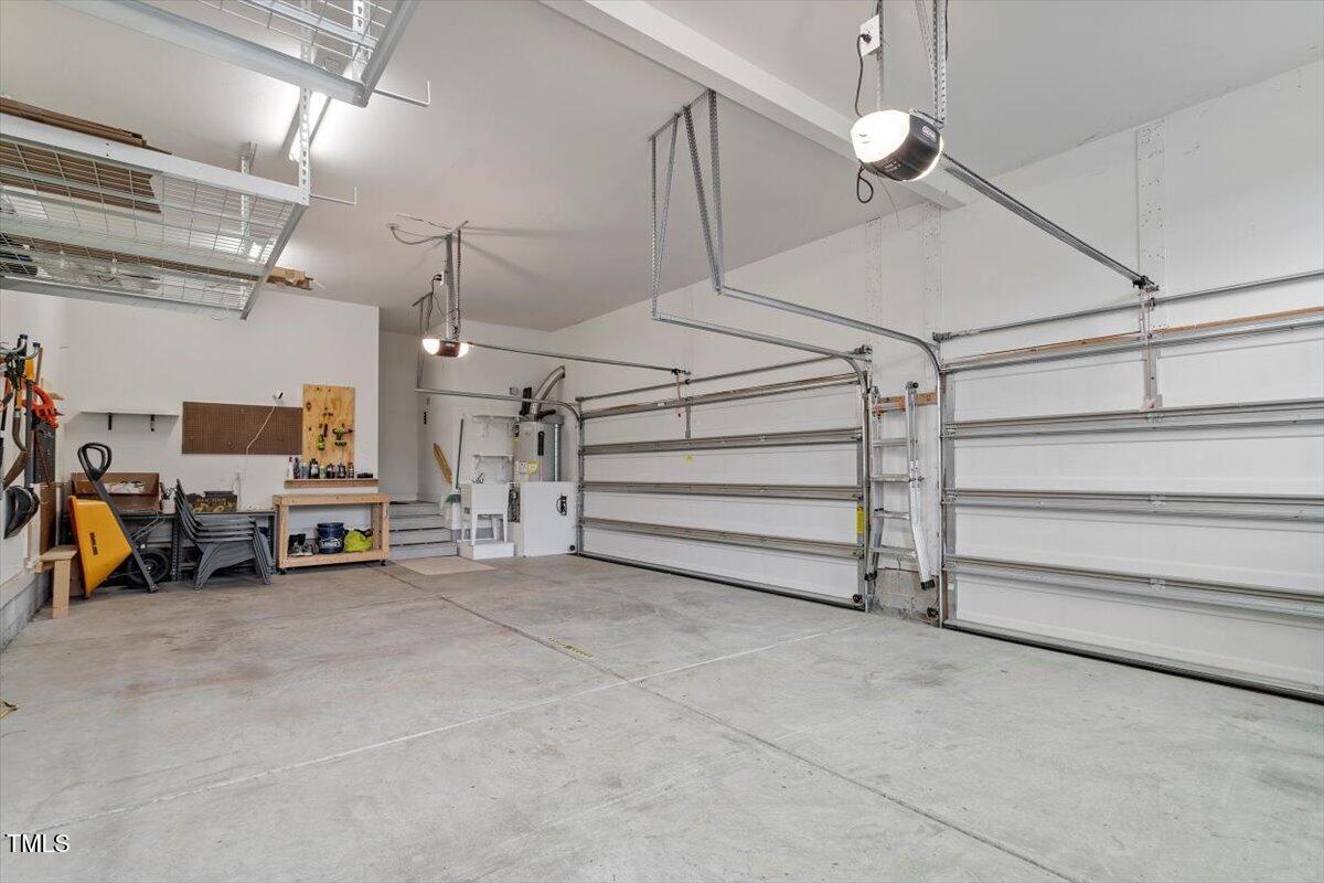 2421 Trenton Park Lane Raleigh, NC 27607 - Photo 43 of 66 a view of a garage with parked cars
