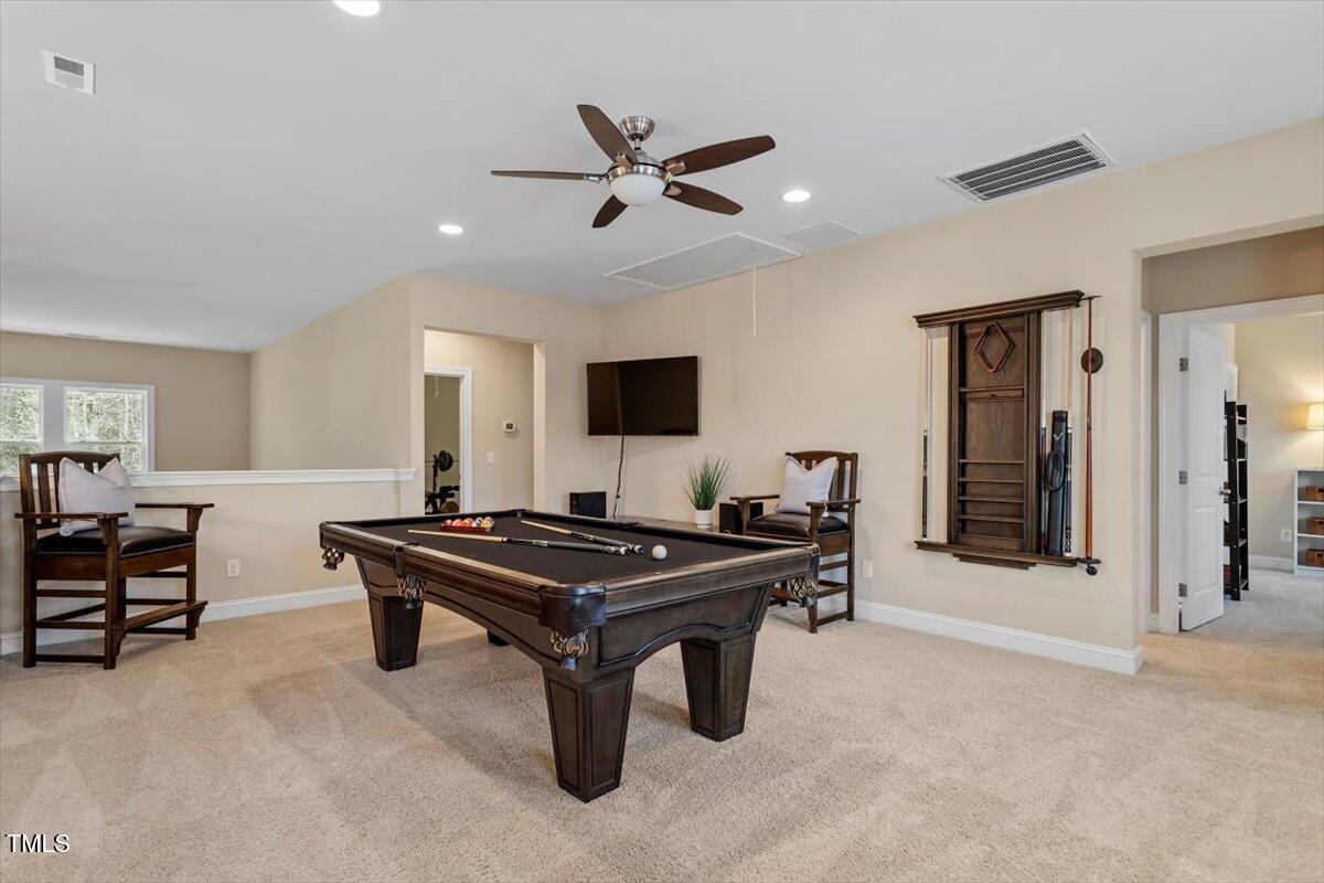2421 Trenton Park Lane Raleigh, NC 27607 - Photo 45 of 66 a view of a livingroom with furniture and a flat screen tv