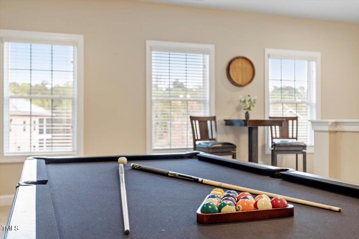 2421 Trenton Park Lane Raleigh, NC 27607 - Photo 47 of 66 a room with wooden floor and windows