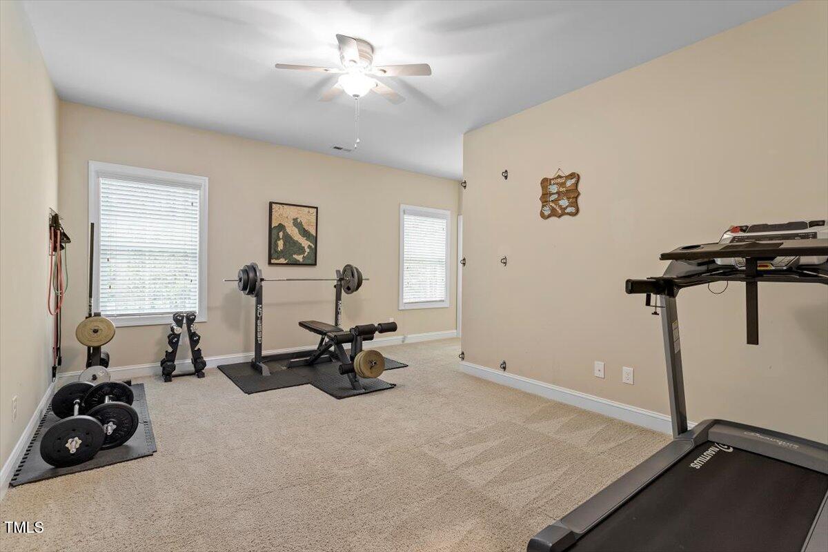 2421 Trenton Park Lane Raleigh, NC 27607 - Photo 54 of 66 a room with gym equipment and a large window