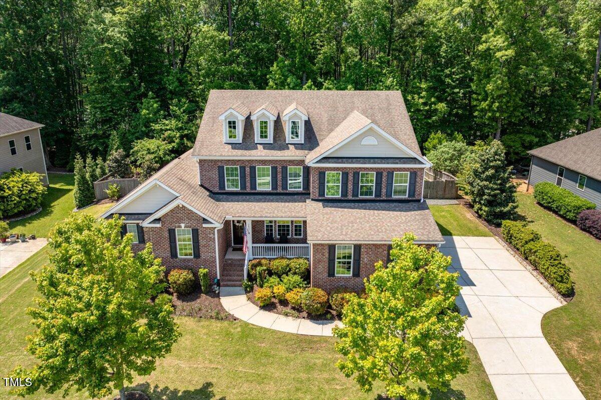 2421 Trenton Park Lane Raleigh, NC 27607 - Photo 57 of 66 front view of a house with a yard