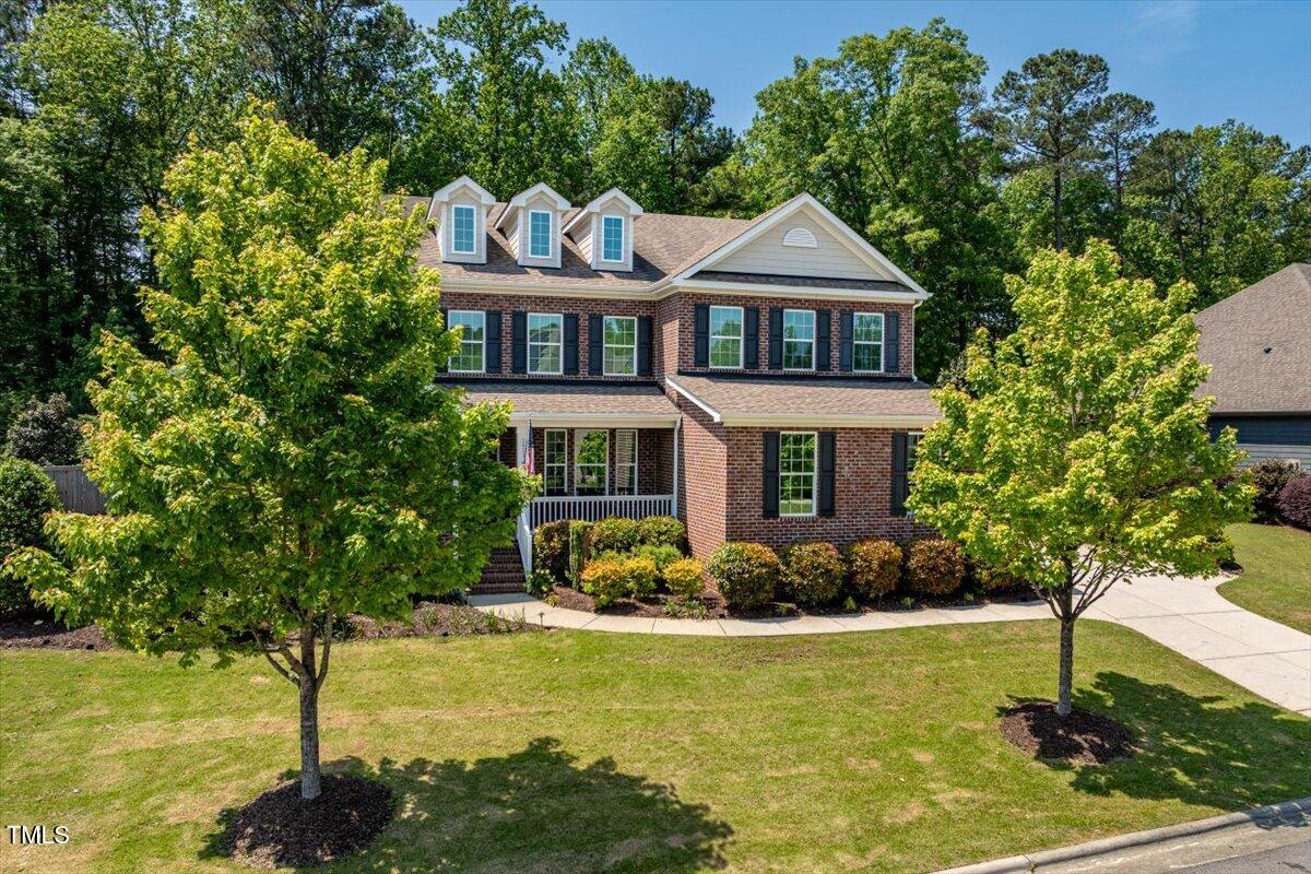 2421 Trenton Park Lane Raleigh, NC 27607 - Photo 58 of 66 a front view of a house with garden