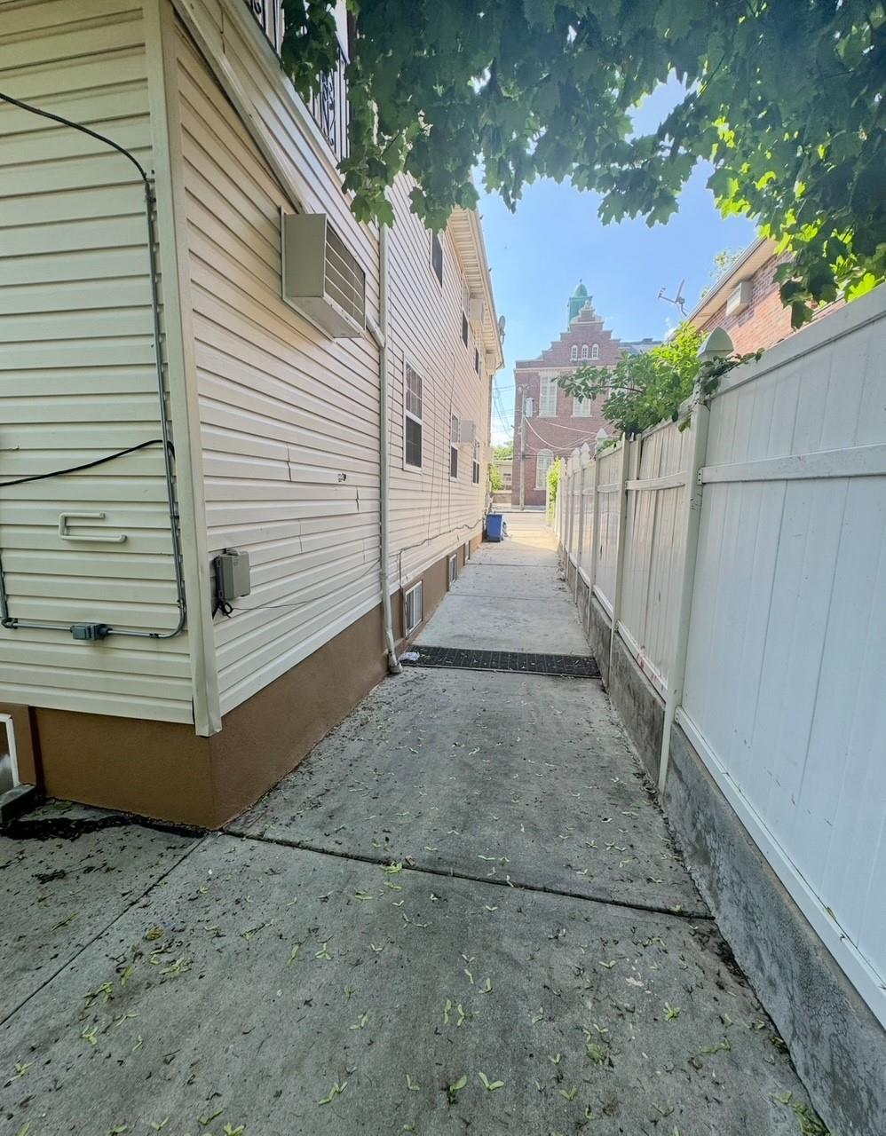 104-65 Springfield Boulevard Queens, NY 11429 - Photo 18 of 23 a view of a house with a yard