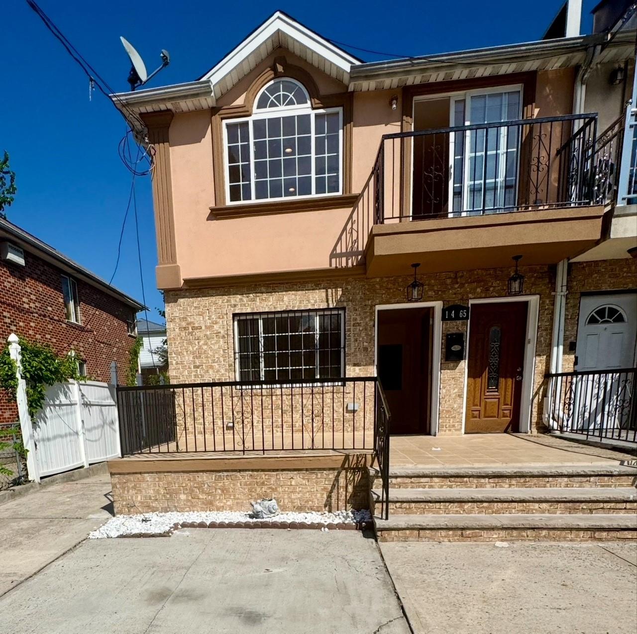104-65 Springfield Boulevard Queens, NY 11429 - Photo 19 of 23 a front view of a house with a garage
