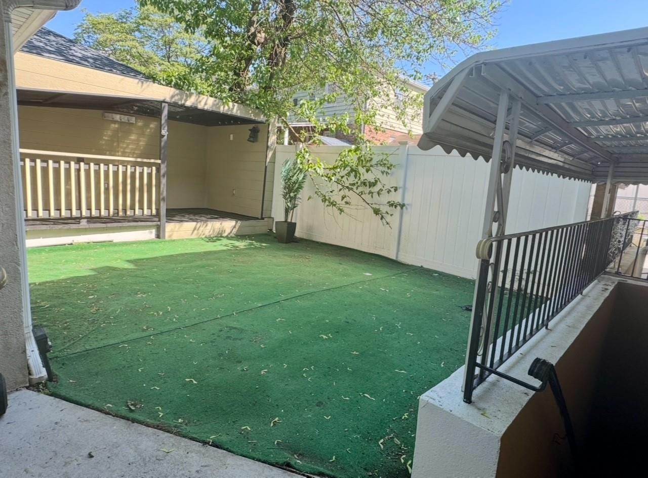 104-65 Springfield Boulevard Queens, NY 11429 - Photo 8 of 23 a view of a porch with a backyard
