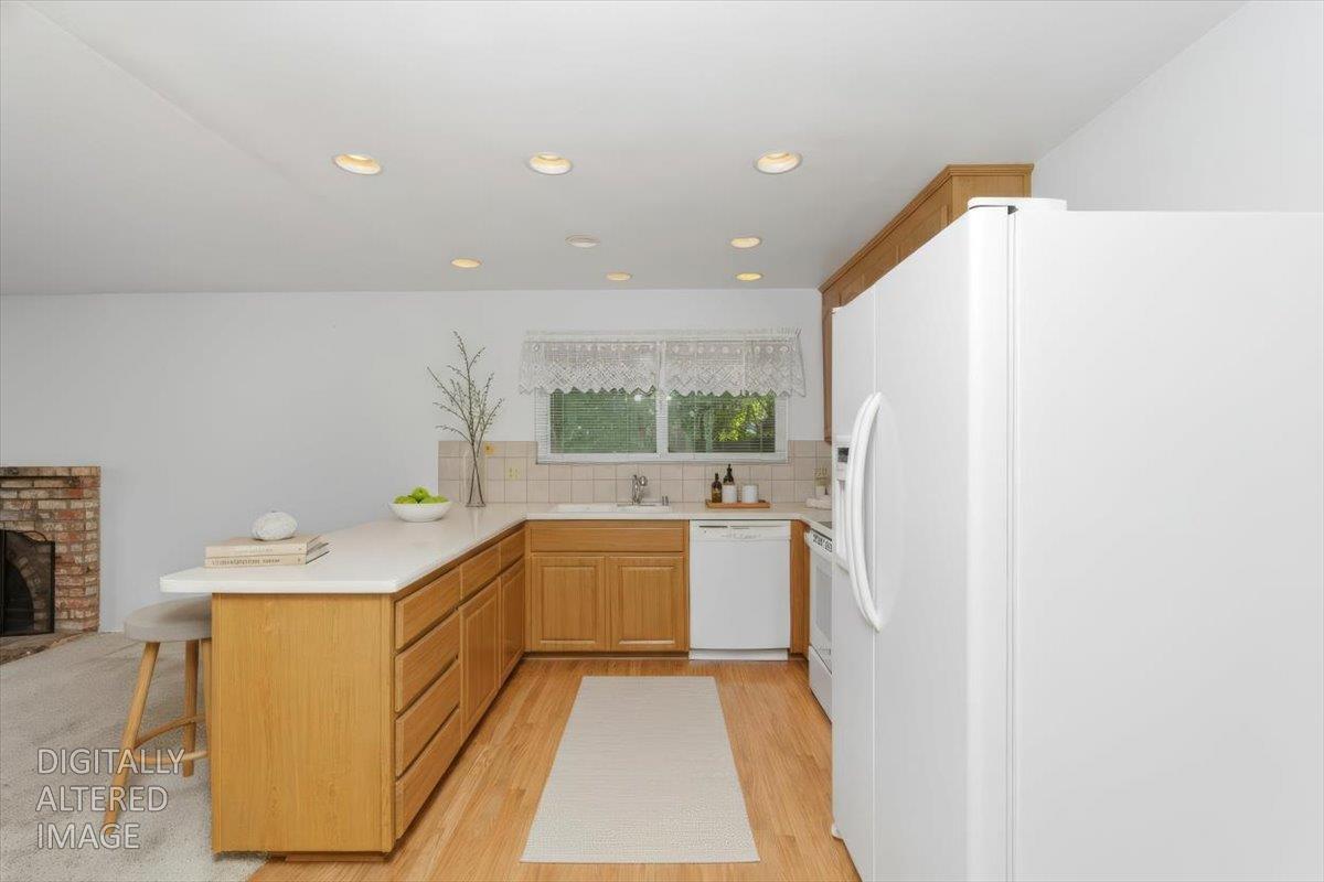 2807 Layton Drive Davis, CA 95618 - Photo 11 of 23 a kitchen with a sink a stove top oven and a refrigerator