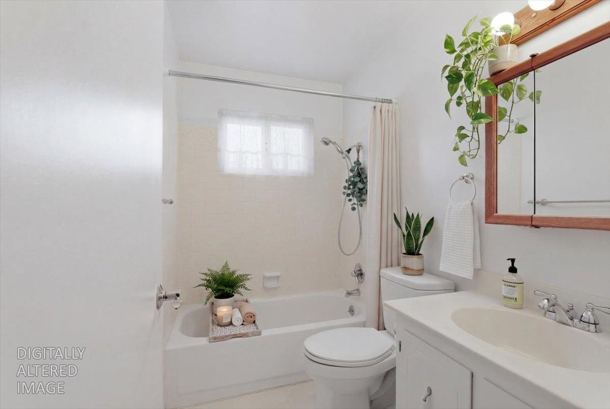 2807 Layton Drive Davis, CA 95618 - Photo 16 of 23 a bathroom with a sink a toilet a window and tub
