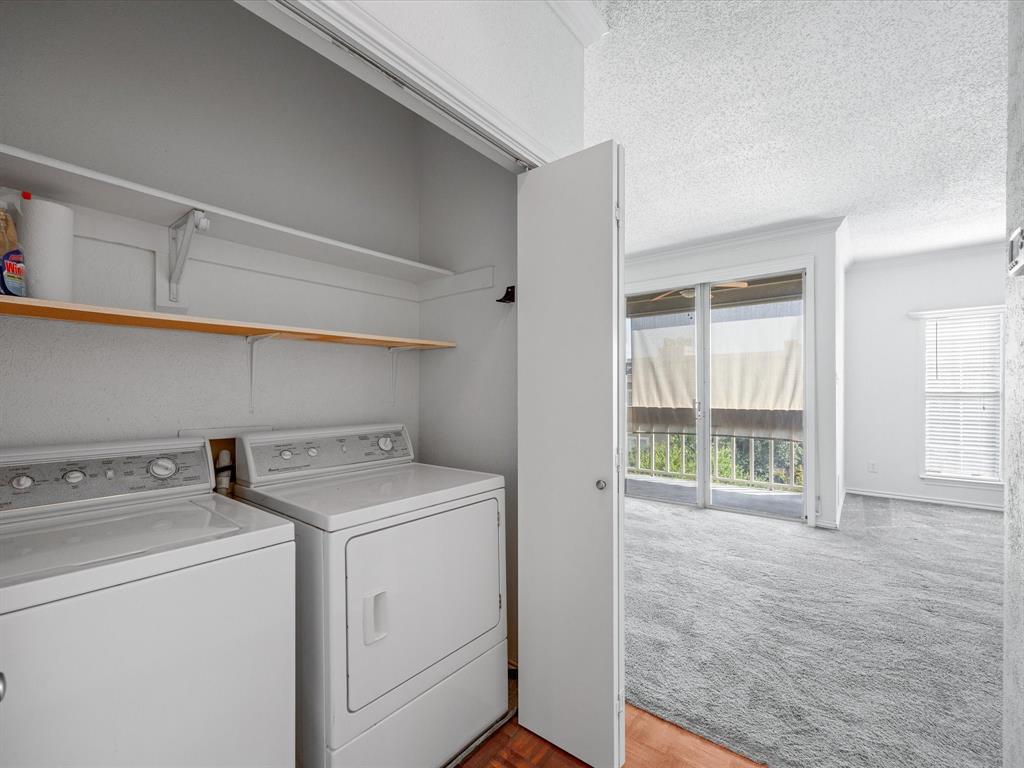 5310 Keller Springs Road, Unit 332 Dallas, TX 75248 - Photo 17 of 39 Washroom with a textured ceiling, washing machine and clothes dryer, and light carpet