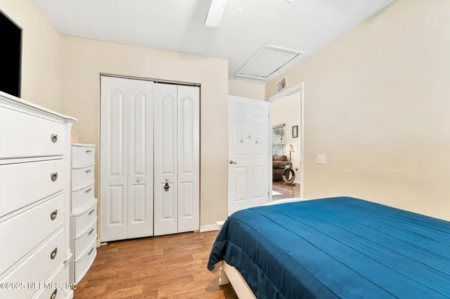 a bedroom with a bed and closet