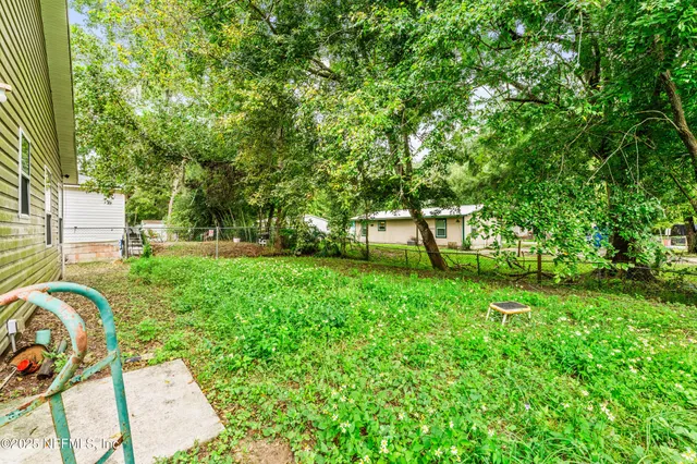 a view of backyard with green space
