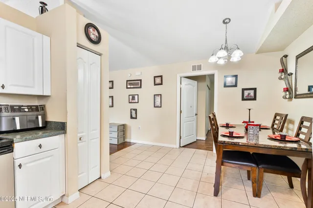 a living room with stainless steel appliances kitchen island granite countertop furniture and a kitchen view