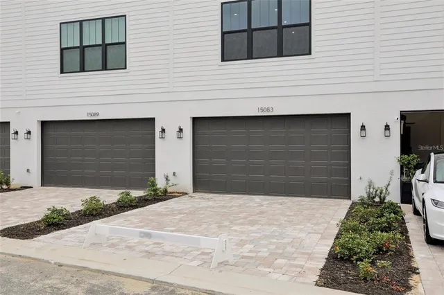 a front view of a house with garage
