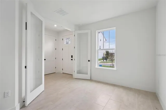a view of an empty room with a window