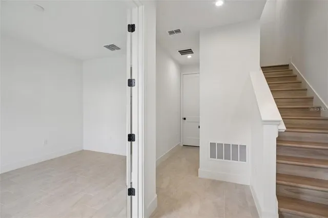 a view of a hallway with a white walls