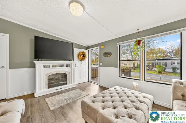 a living room with furniture and a fireplace