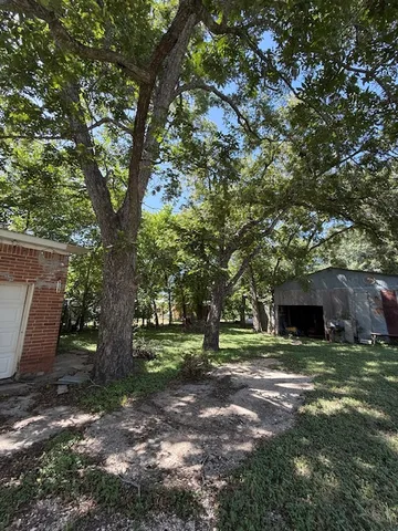 a view of outdoor space with deck and a tree