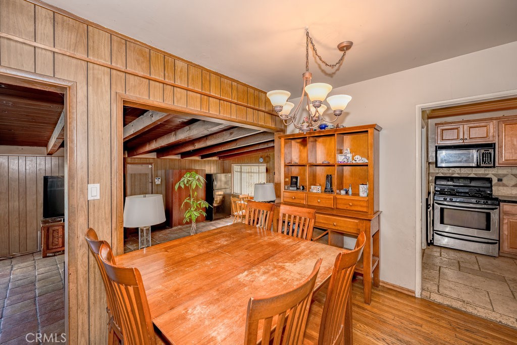 17654 Welby Way Van Nuys, CA 91406 - Photo 11 of 26 a view of a dining room with furniture and wooden floor