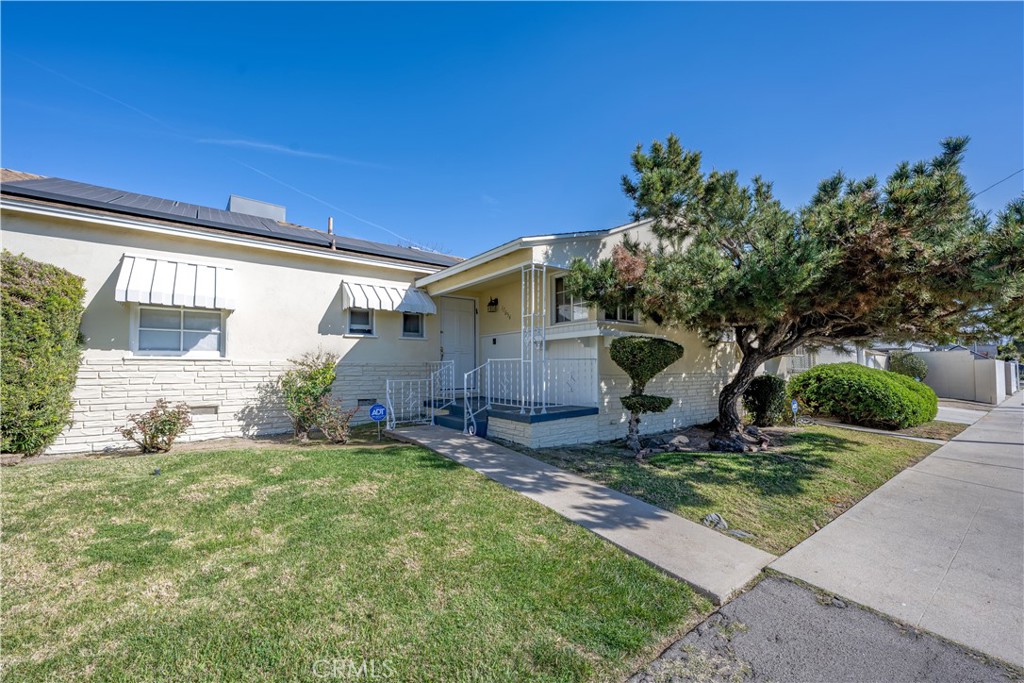 17654 Welby Way Van Nuys, CA 91406 - Photo 2 of 26 a view of a house with backyard and sitting area
