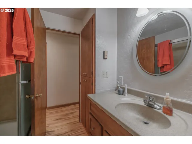 a bathroom with a sink and a mirror