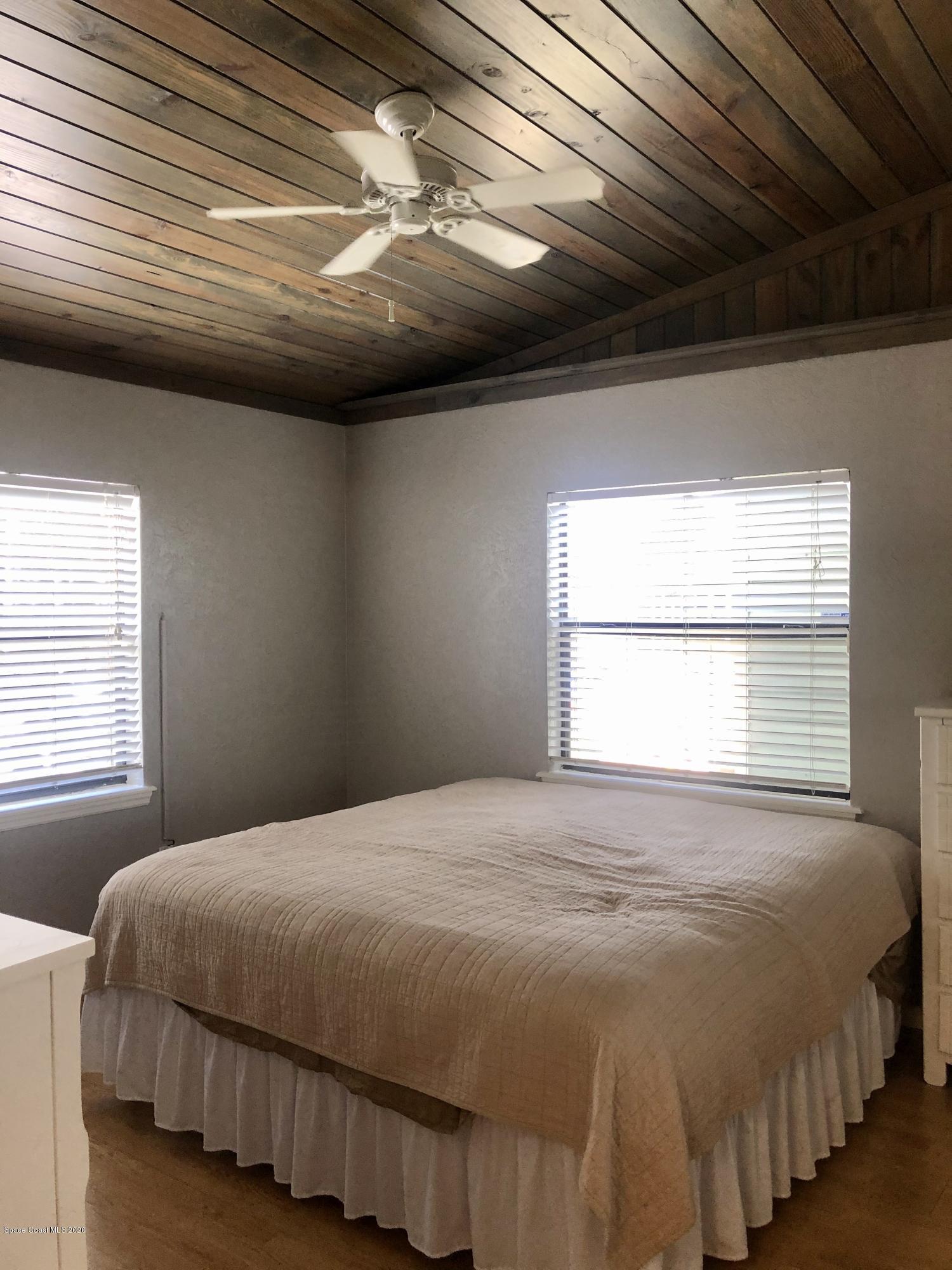 2224 Laden Road Melbourne, FL 32935 - Photo 15 of 26 a bedroom with a bed and window