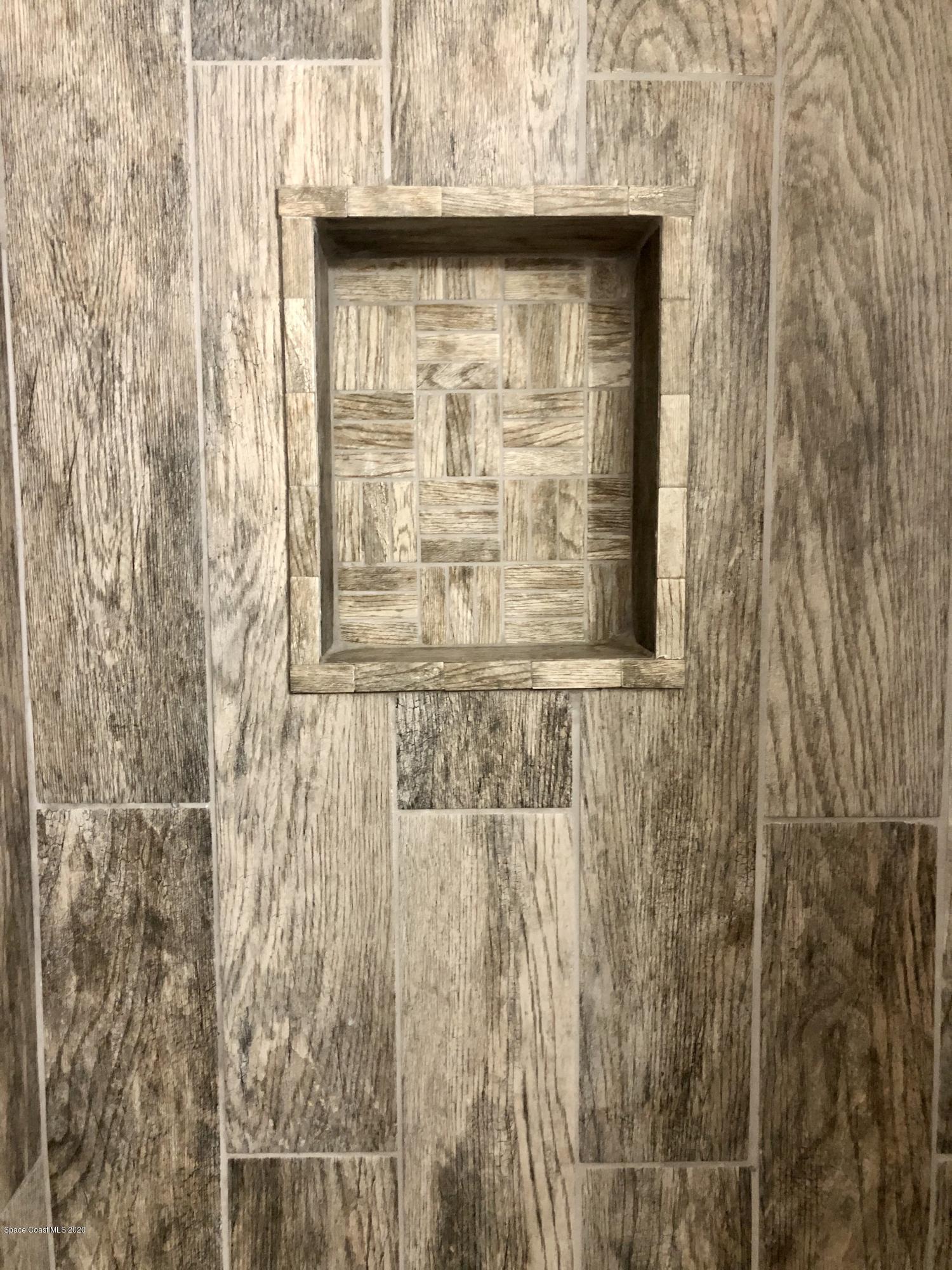 2224 Laden Road Melbourne, FL 32935 - Photo 17 of 26 a bathroom with a shower