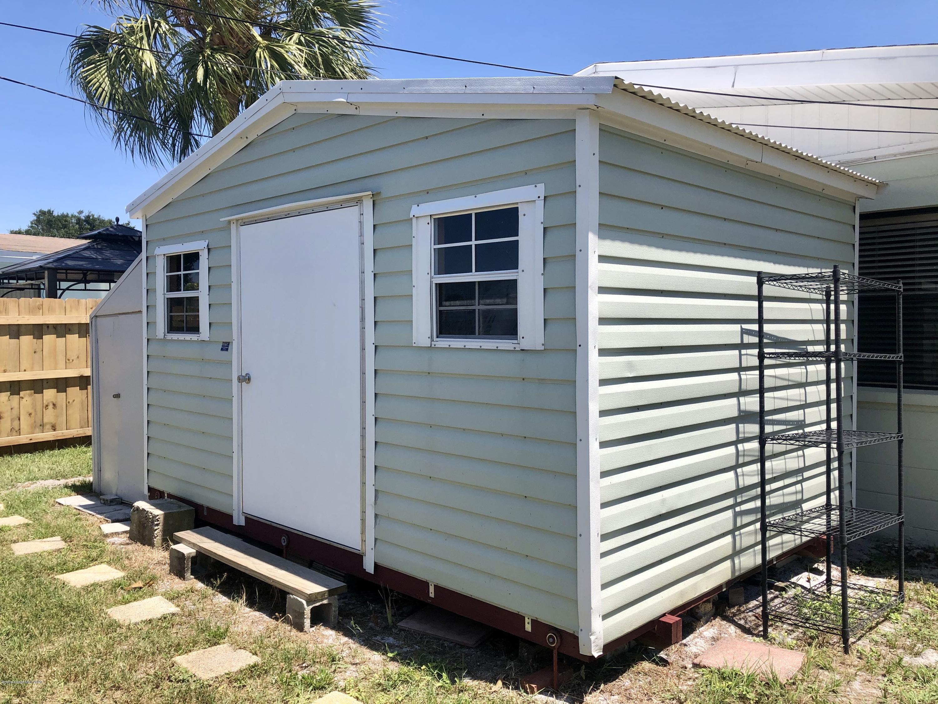 2224 Laden Road Melbourne, FL 32935 - Photo 20 of 26 a view of a house with a yard