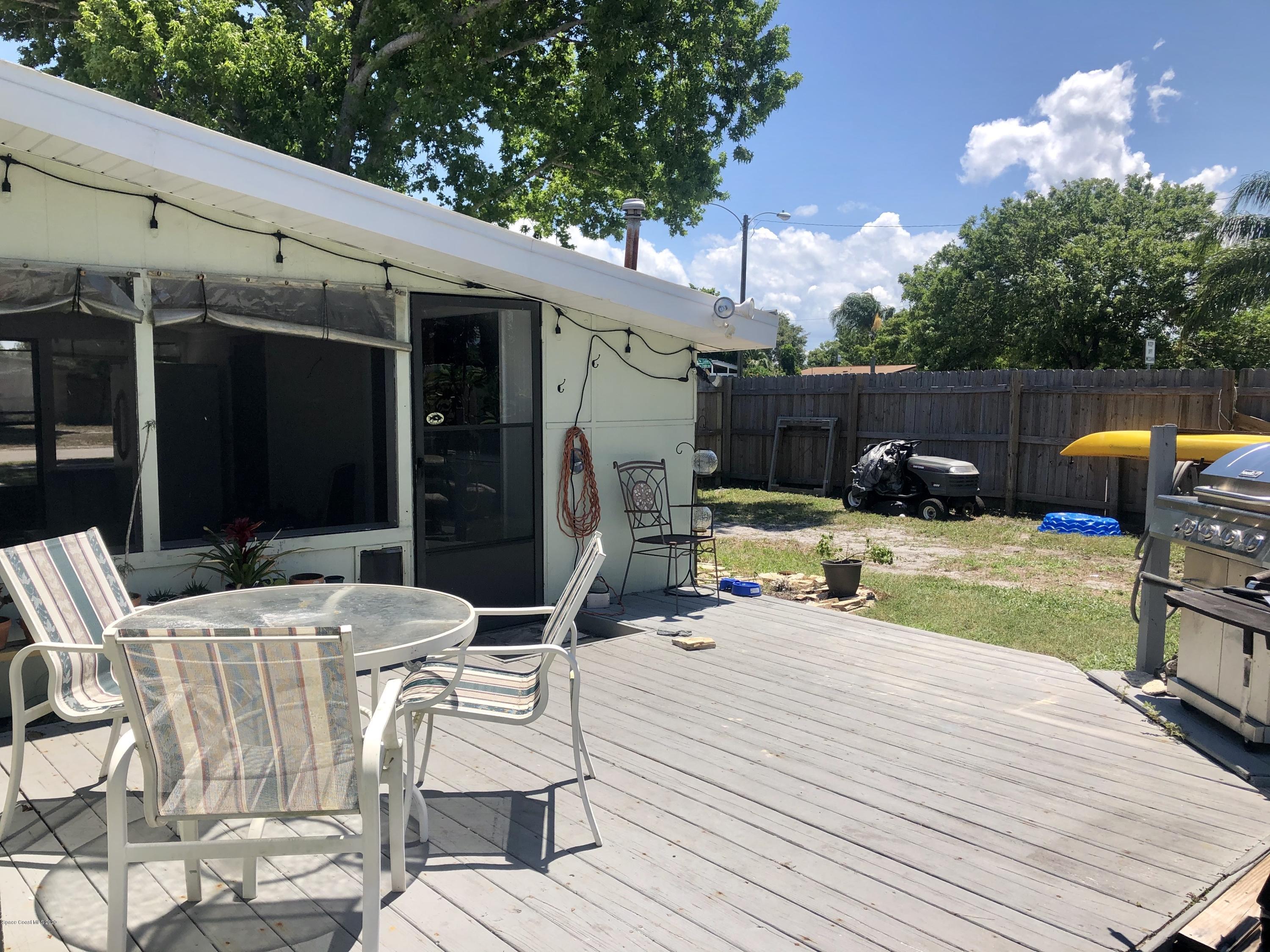 2224 Laden Road Melbourne, FL 32935 - Photo 21 of 26 a view of outdoor space yard deck patio and fire pit