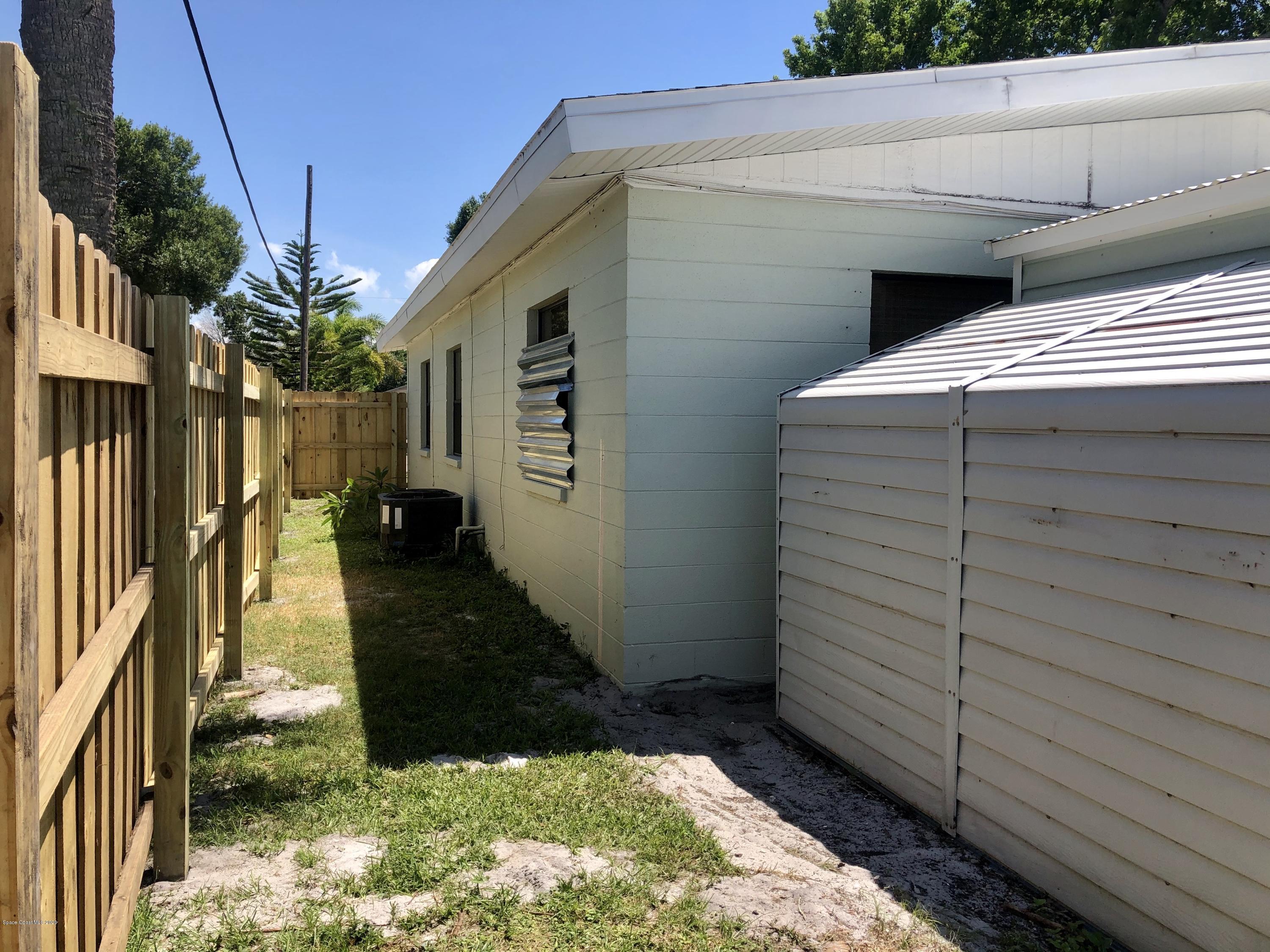 2224 Laden Road Melbourne, FL 32935 - Photo 23 of 26 a view of a house with a door