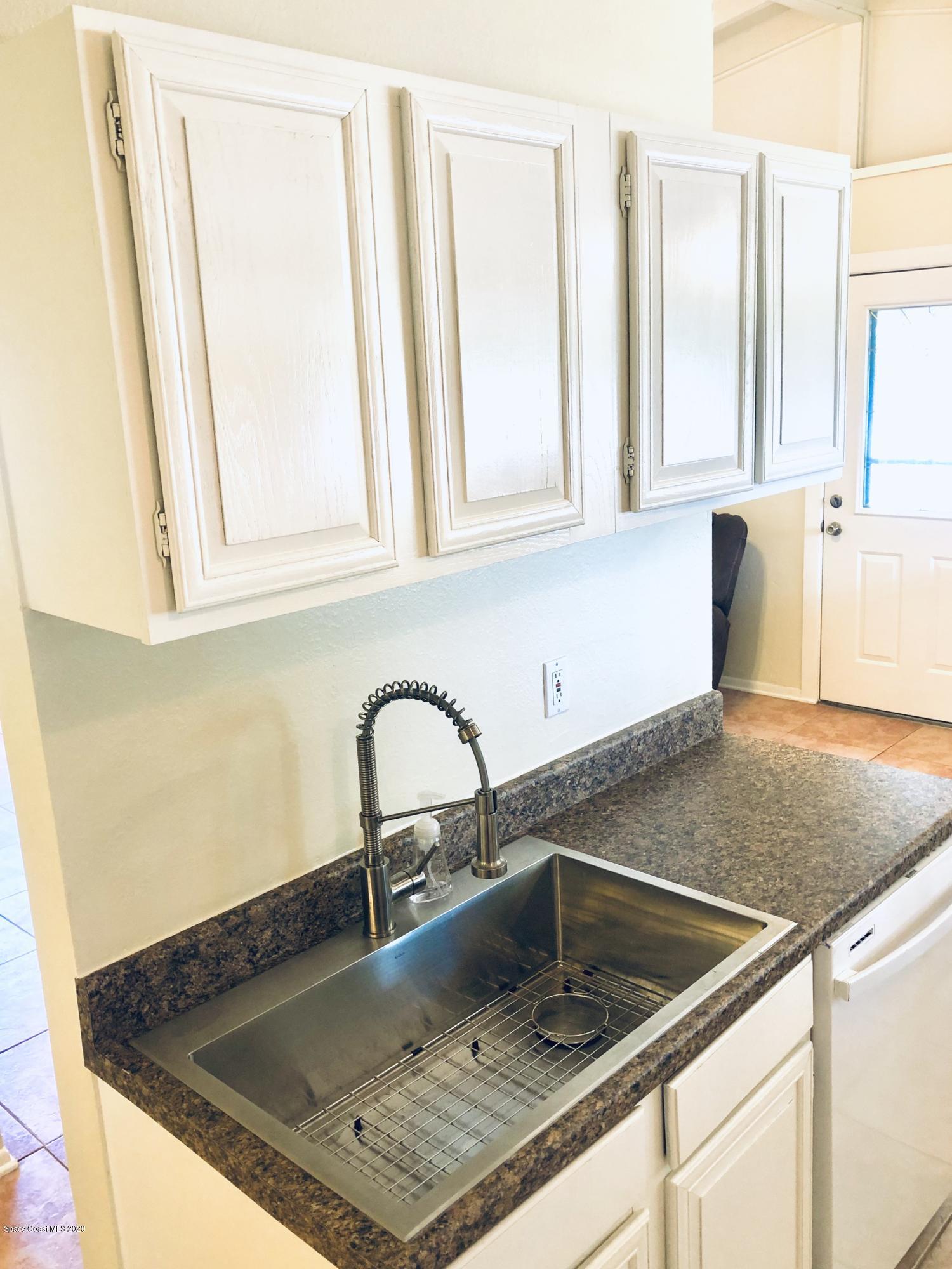 2224 Laden Road Melbourne, FL 32935 - Photo 5 of 26 a close view of sink and tap