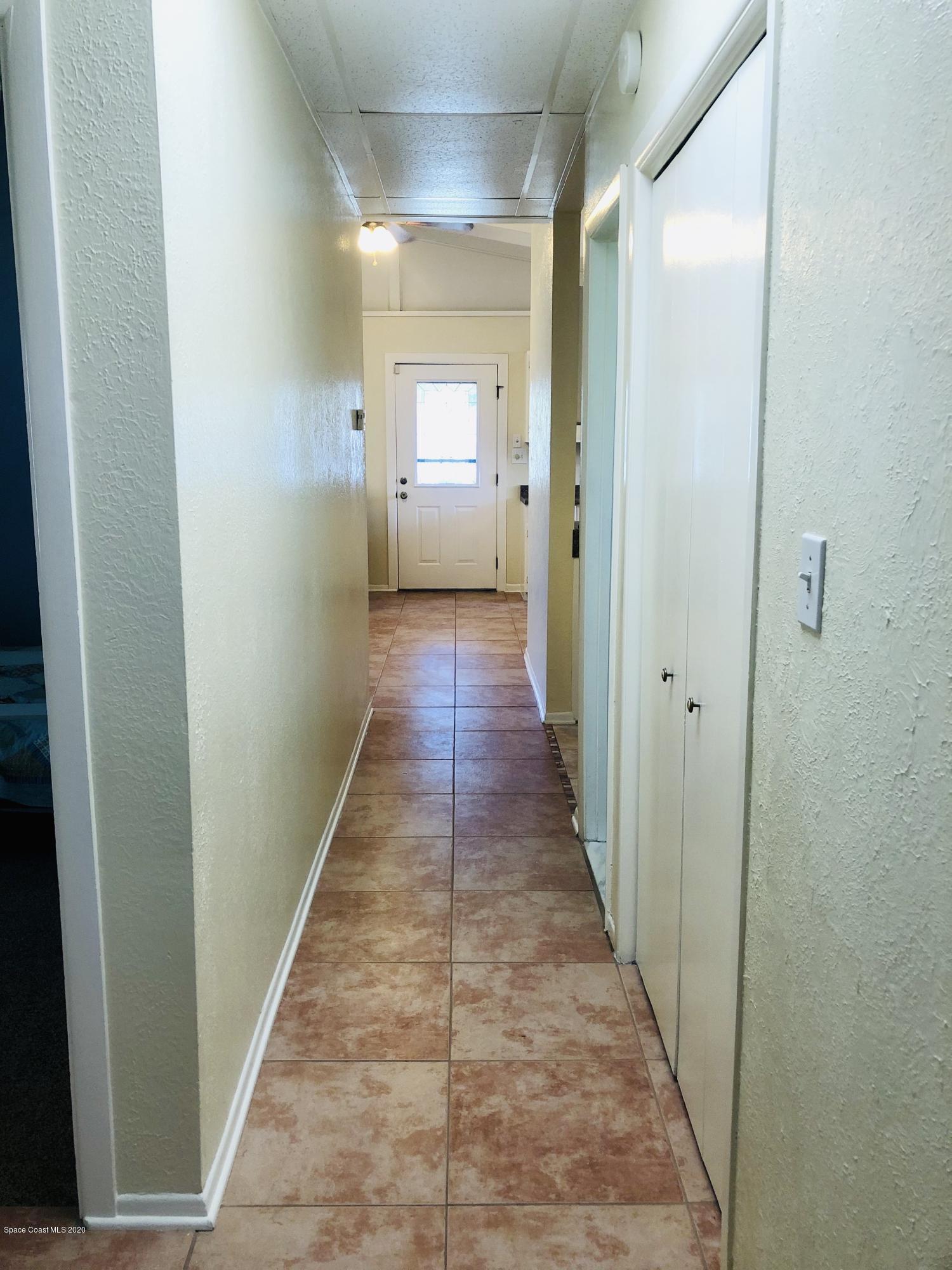 2224 Laden Road Melbourne, FL 32935 - Photo 10 of 26 a view of a hallway with wooden floor