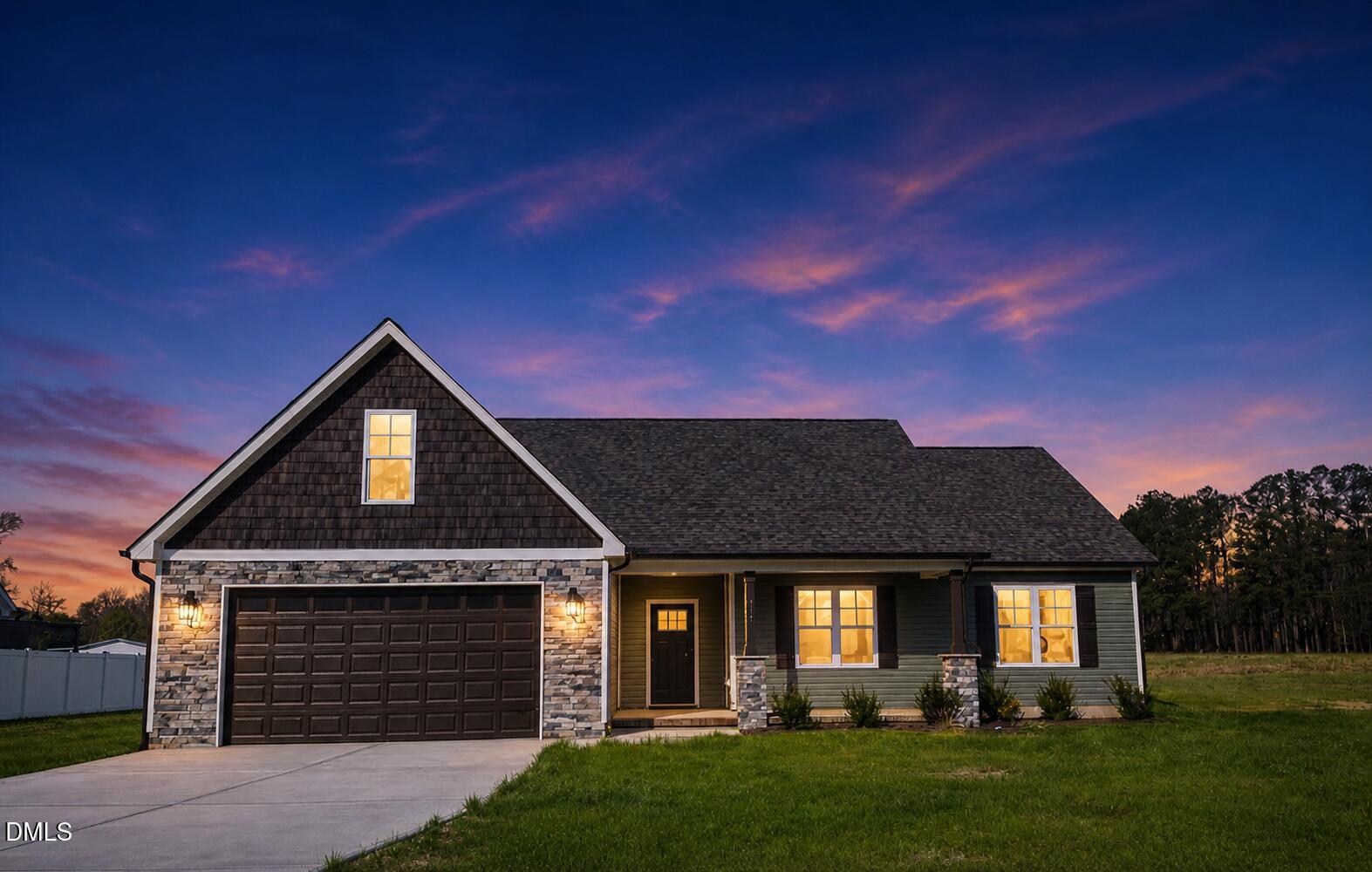 165 Bay Valley Road Kenly, NC 27542 - Photo 1 of 22 a front view of a house with a garden and yard