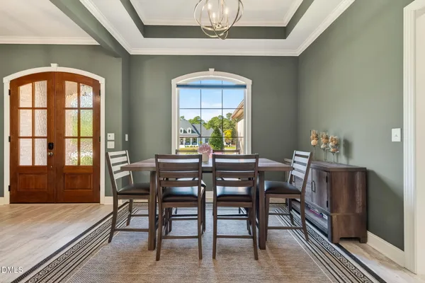 a view of hallway with wooden floor