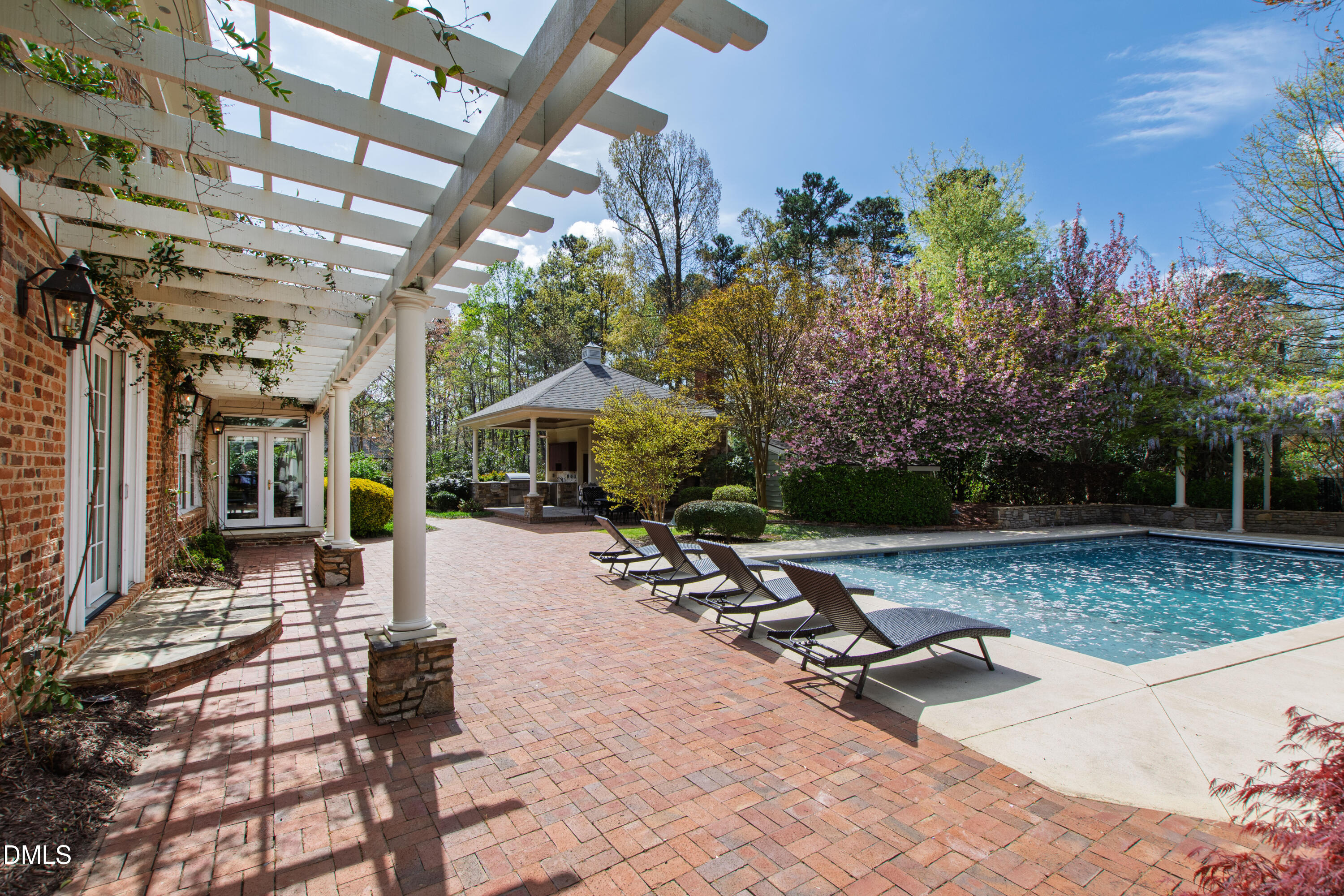2111 Cook Ridge Court Raleigh, NC 27615 - Photo 8 of 83 a view of a patio with a table and chairs under an umbrella