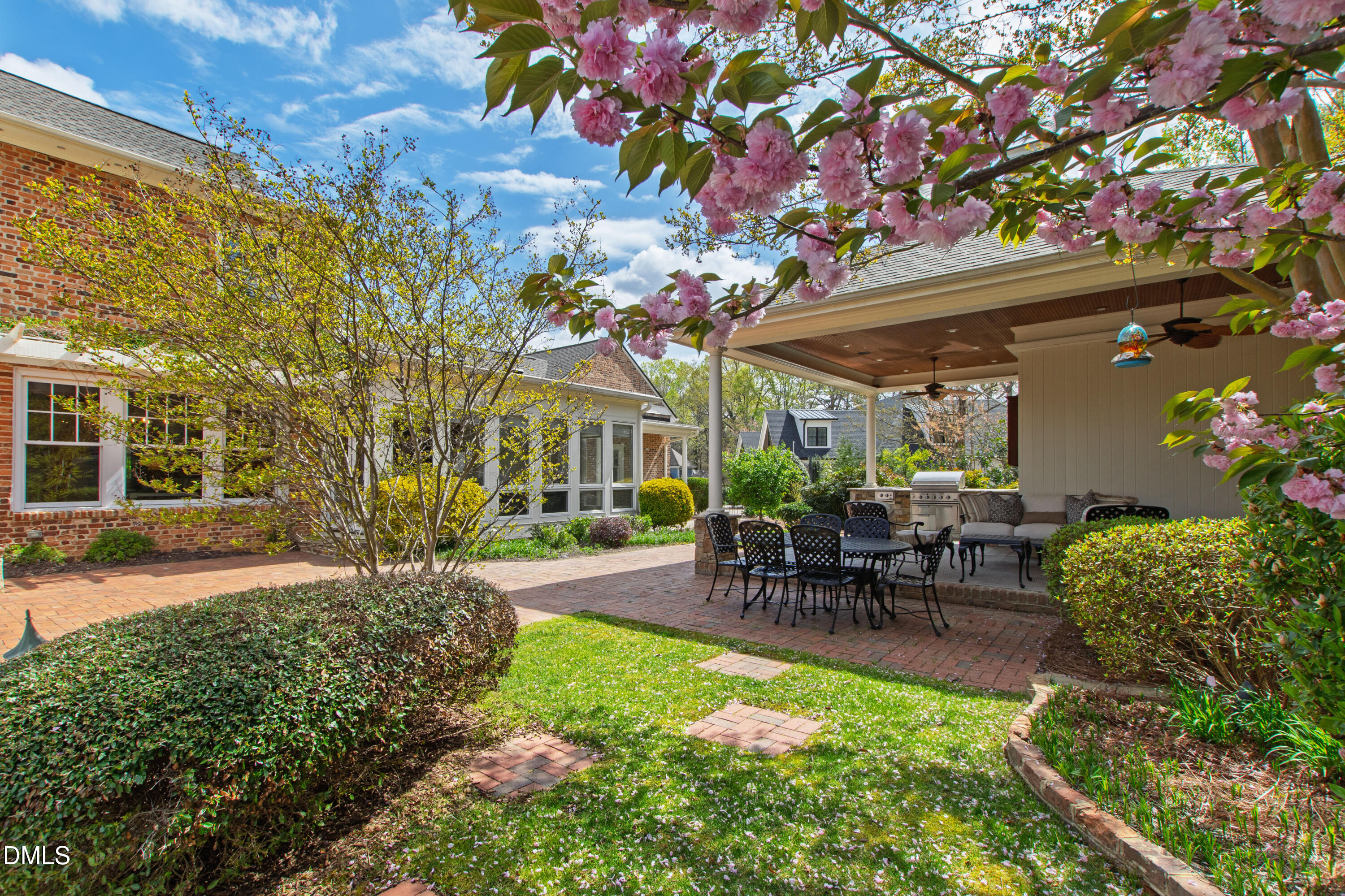 2111 Cook Ridge Court Raleigh, NC 27615 - Photo 12 of 83 a view of a patio with table and chairs and potted plants