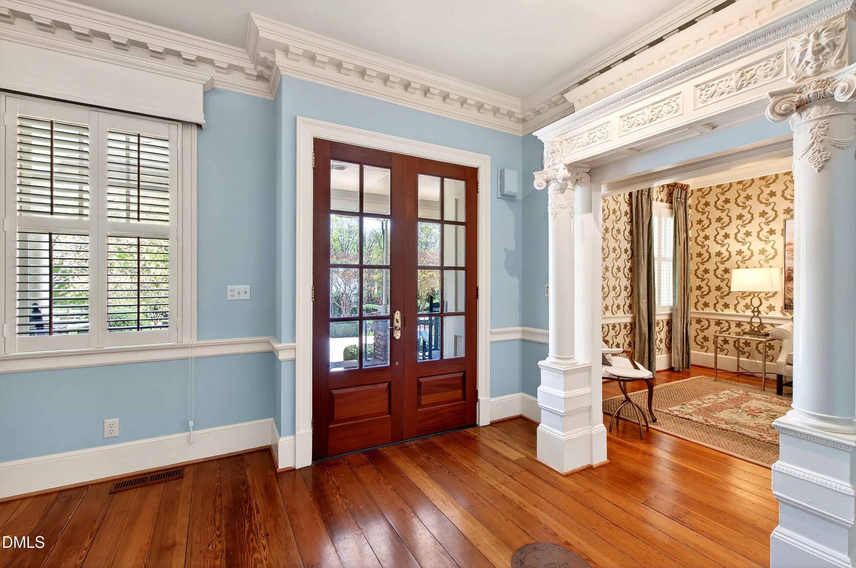 2111 Cook Ridge Court Raleigh, NC 27615 - Photo 16 of 83 a view of an empty room with glass door and wooden floor