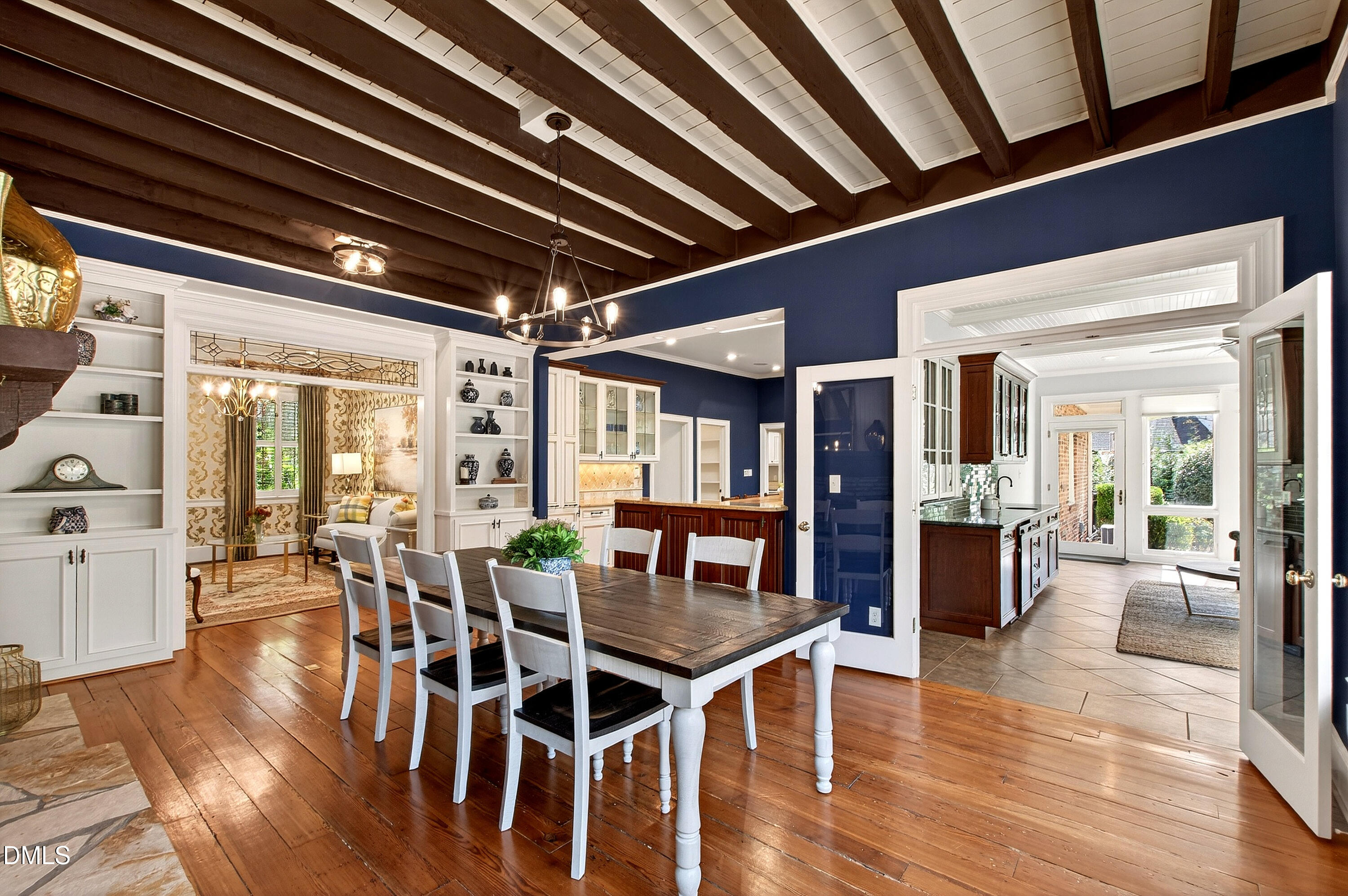 2111 Cook Ridge Court Raleigh, NC 27615 - Photo 21 of 83 a view of a dining room with furniture wooden floor and chandelier