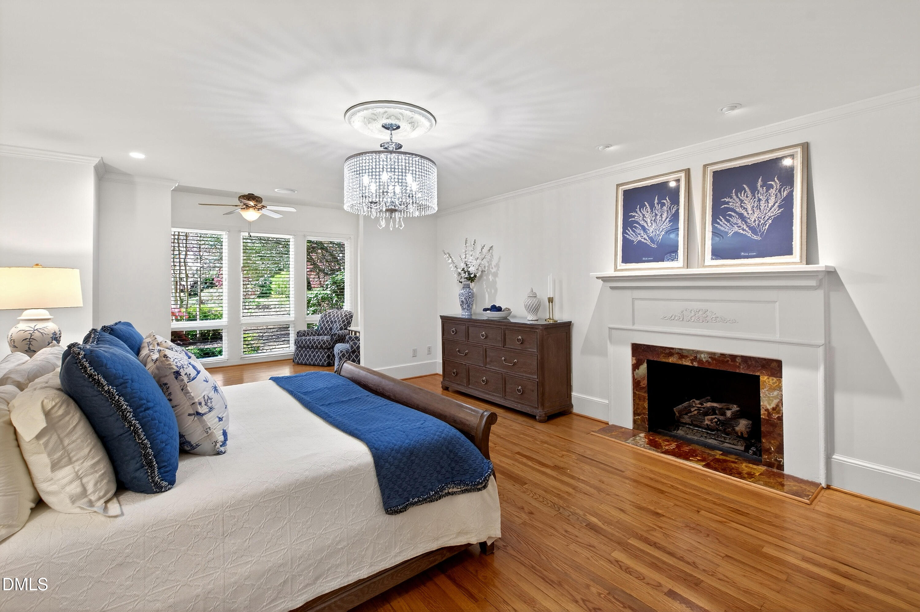 2111 Cook Ridge Court Raleigh, NC 27615 - Photo 34 of 83 a spacious bedroom with a bed and a fireplace